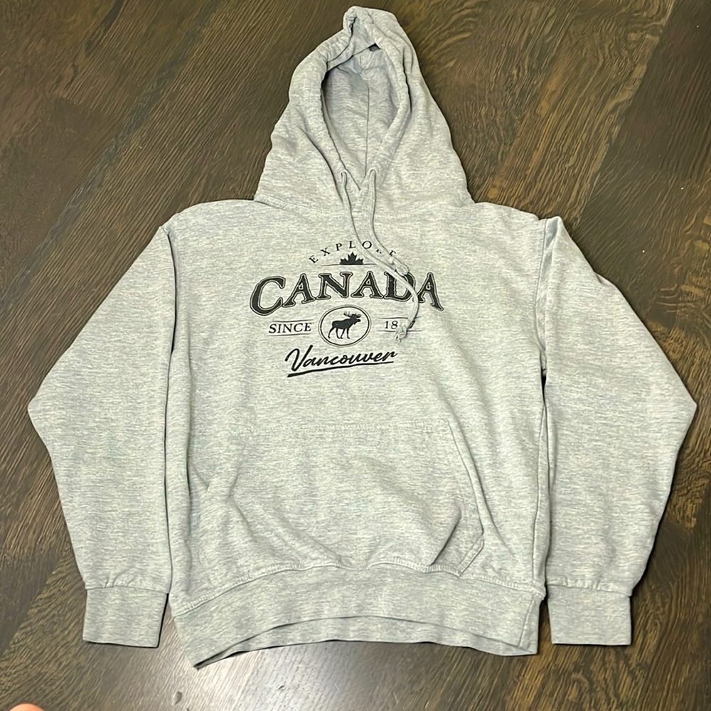 Grey hoodie from Vancouver. Has some wording and other characteristics.